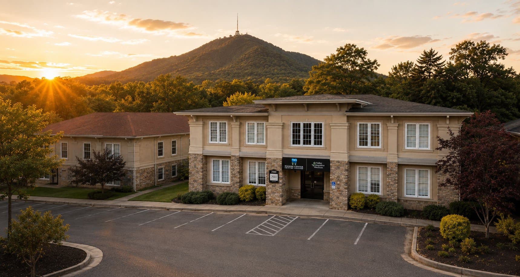 The Roanoke Dental Center office on Electric Rd at dusk, with Mill Mountain and the Roanoke Star rising behind it