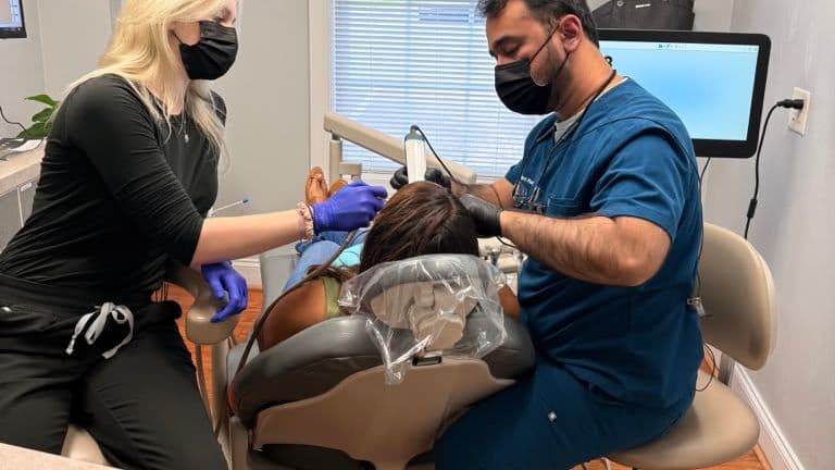 A Roanoke Dental Center dentist and assistant working together chairside