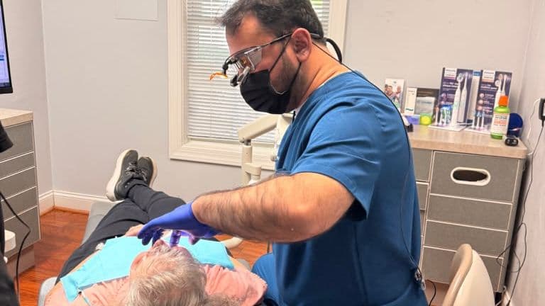 A Roanoke Dental Center dentist caring for a patient in the treatment chair