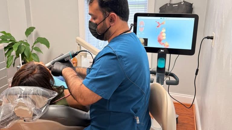 A Roanoke Dental Center dentist capturing a digital impression scan of a patient's teeth