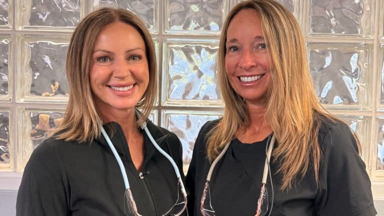 Two smiling members of the Roanoke Dental Center clinical team